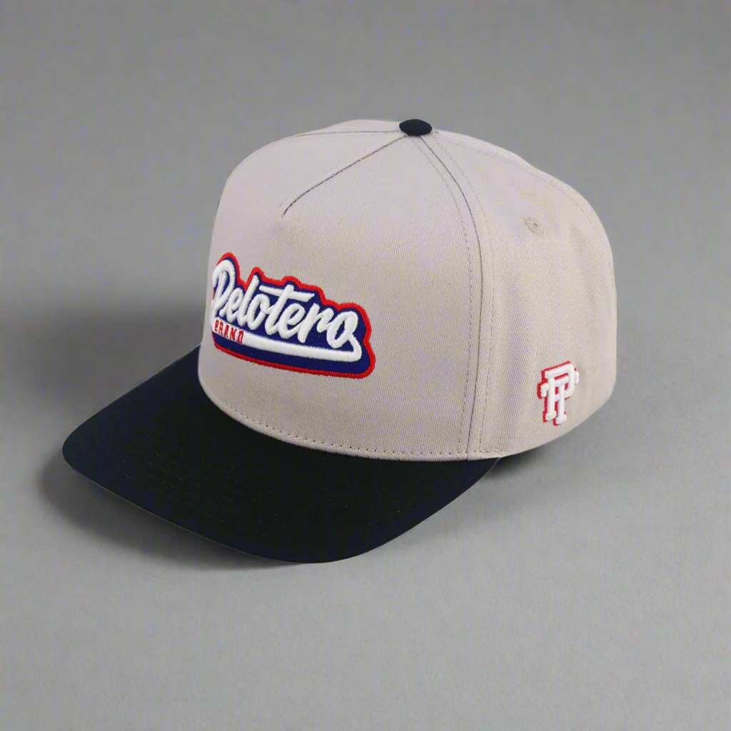 Beige and black cap with 'Delotero' branding on a white background