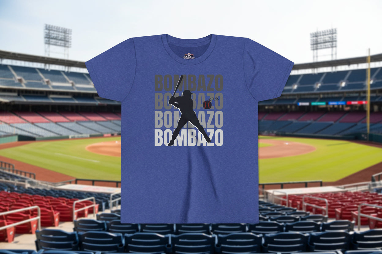 Blue t-shirt with a graphic of a baseball player and the word 'BOMBAZO' printed multiple times on a white background.
