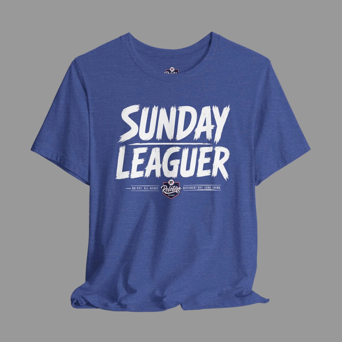 A heather blue crewneck t-shirt featuring a white graphic print that reads 'SUNDAY LEAGUER' with a small baseball logo underneath, displayed on a light gray background.
