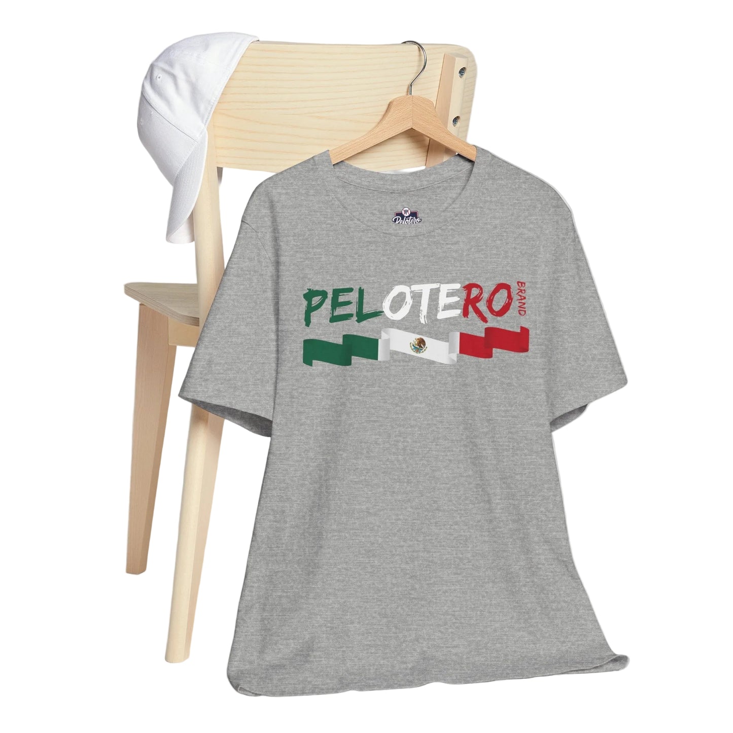 Gray t-shirt with 'PELOTERO' text and flag design on a wooden chair.