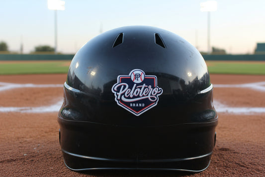 Black helmet with a logo on a grassy field